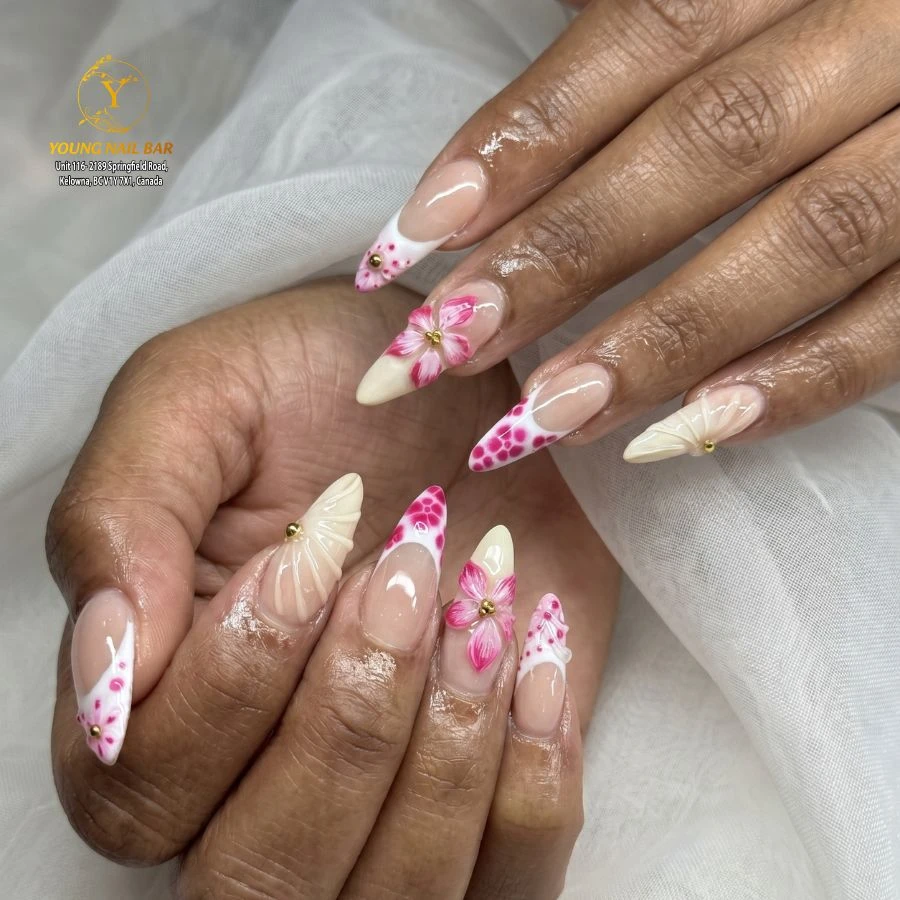 Pink floral nail art with white French tips at Young Nail Bar