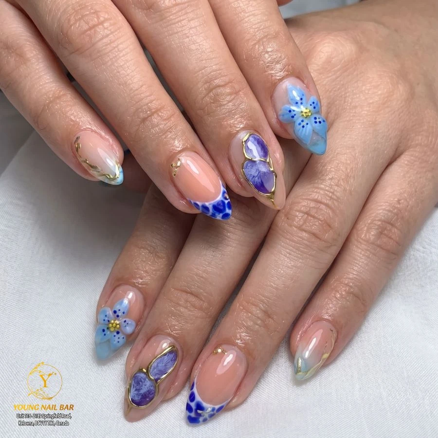 Blue floral and purple detail nail art at Young Nail Bar