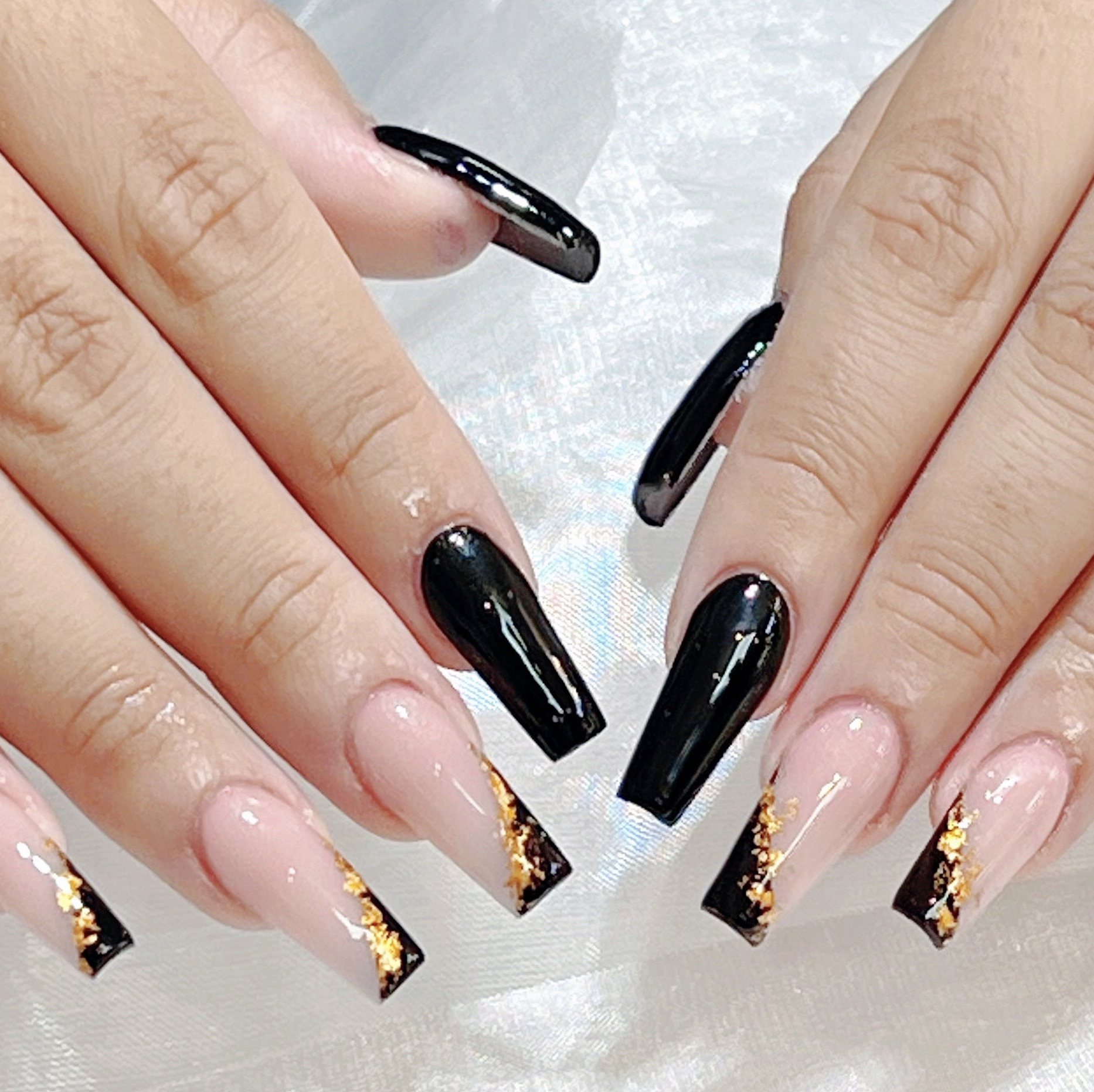 Black and gold French nail design at Young Nail Bar